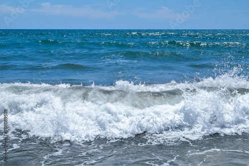 Fototapeta Naklejka Na Ścianę i Meble -  Blue sea  wiht wave and blue sky background. Summer sea and blue sky.