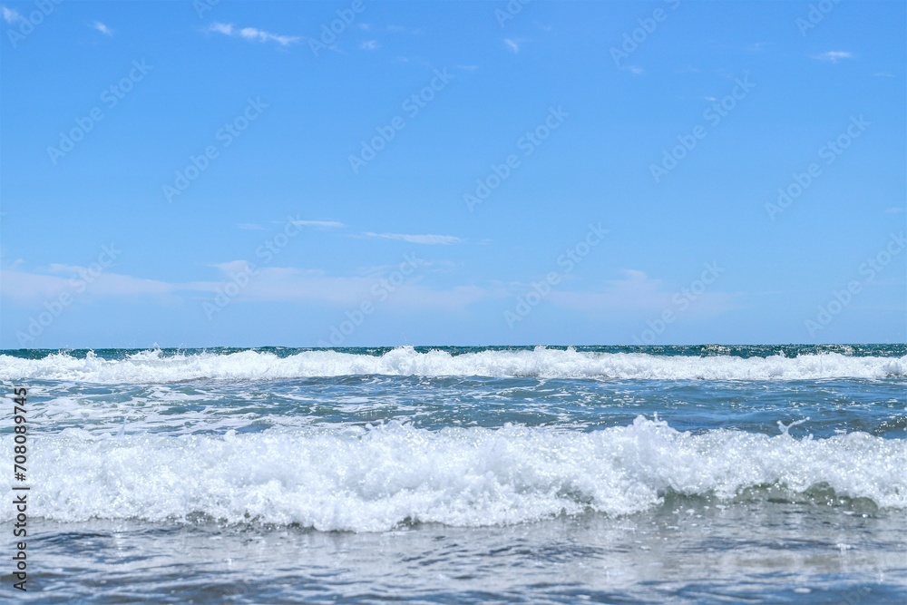 Blue sea  wiht wave and blue sky background. Summer sea and blue sky.