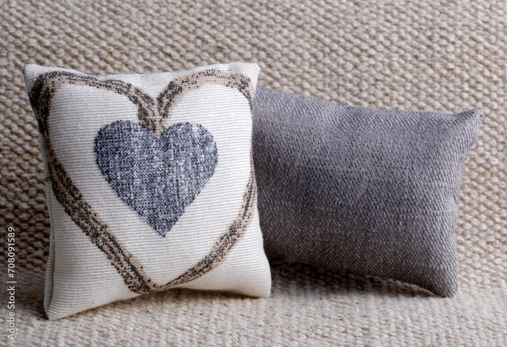 Cushion with heart shape on the sofa Cushion with heart shape on the sofa