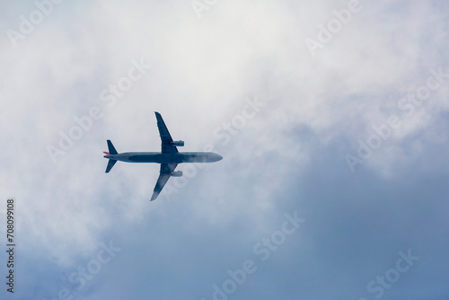 Passenger plane passing through the clouds