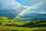 Brilliant rainbow arching over a lush green valley
