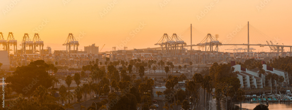 Thousands of shipping containers in the port of Long Beach near Los Angeles California. The Port of Long Beach in southern California during sunset.