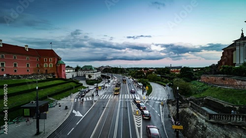 4K Time Lapse, floating clouds over traf ic on a streen in historical center of Warsaw, Poland photo