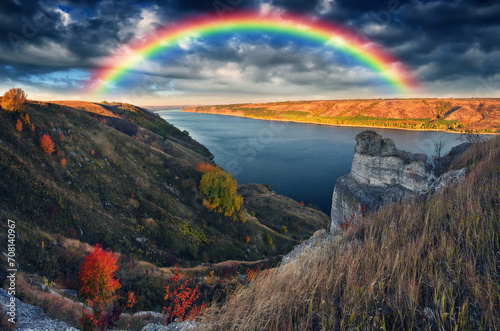 Rainbow over the river Dnister. Landscape with a rainbow in the sky. Nature of Ukraine