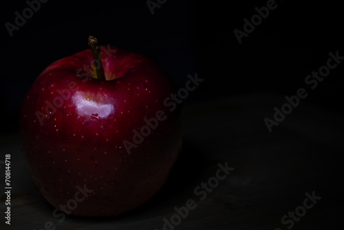 red apple on black