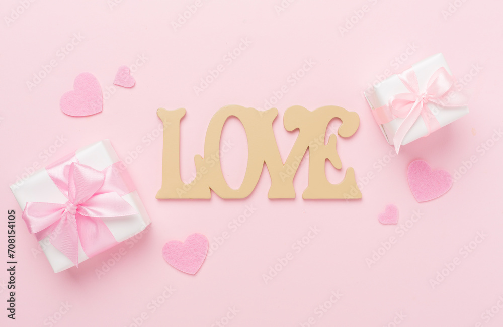 Valentines day composition with gifts on color background, top view.