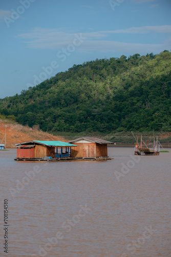  fishing village with a house on the surface of the water. © Supat