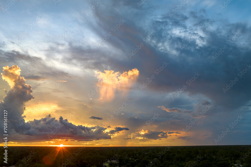 Colorful evening landscape with soft pastel coloured clouds on watercolor tinted sunset sky. Abstract nature background Colorful evening landscape with soft pastel coloured clouds on watercolor tinted sunset sky. Abstract nature background