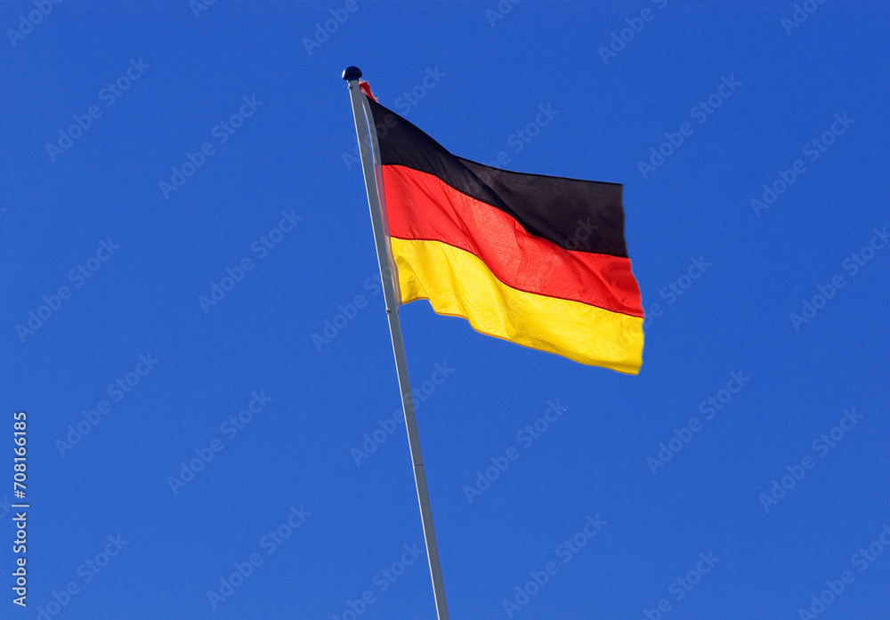 german national flag on a pole, blue sky as background, Germany german national flag on a pole, blue sky as background, Germany