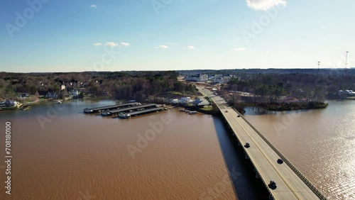 Cars traverse bridge over Lake Wylie and cross state line on a sunny afternoon photo