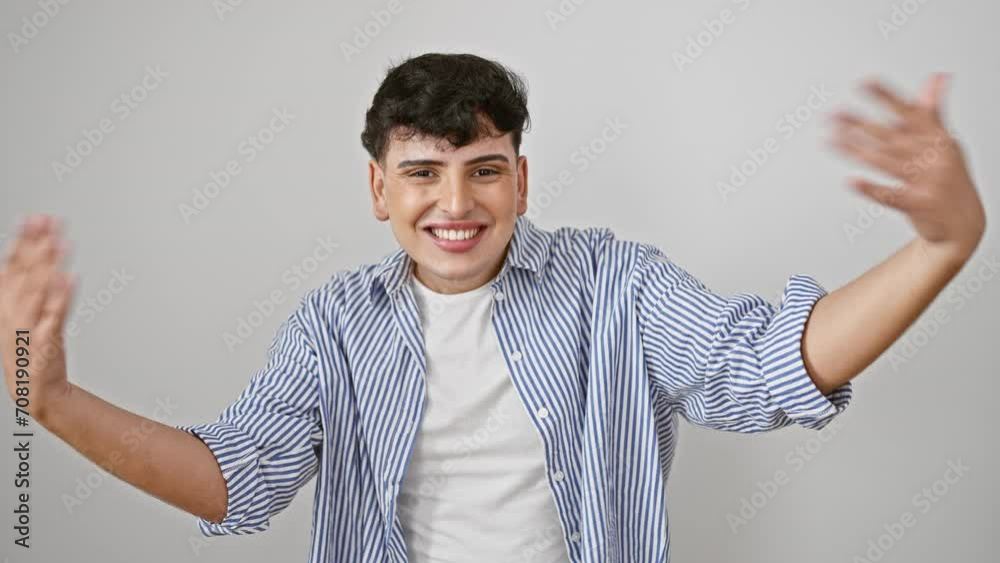 Cheerful young man in striped shirt, arms wide open for a friendly hug. smiling with happiness, standing against an isolated white background, ready to embrace love and success Cheerful young man in striped shirt, arms wide open for a friendly hug. smiling with happiness, standing against an isolated white background, ready to embrace love and success