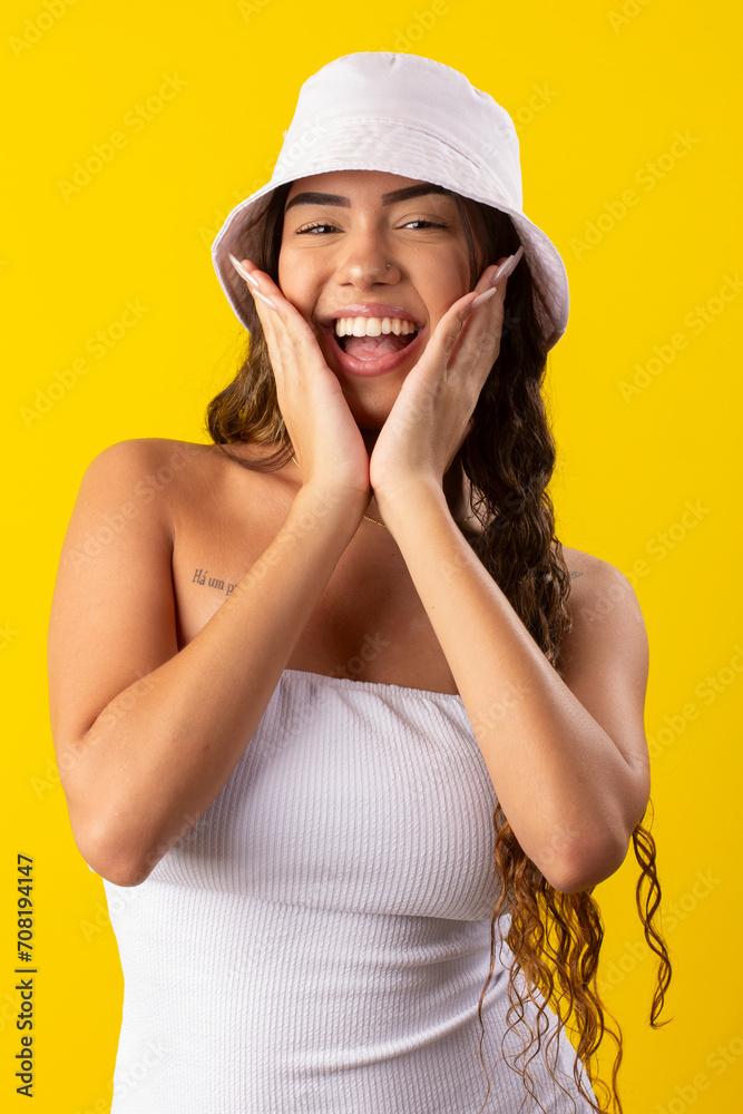 young woman wearing white dress on a yellow background young woman wearing white dress on a yellow background