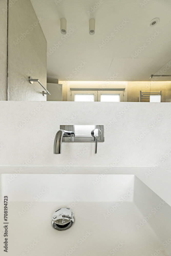 A modern style monobloc imitation stone sink with modern design taps, LED lamps on the ceiling A modern style monobloc imitation stone sink with modern design taps, LED lamps on the ceiling