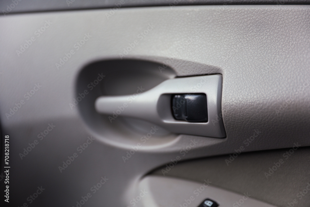 Close-up of a sleek car door handle, embodying modern design and luxury, with reflections hinting at adventure and elegance Close-up of a sleek car door handle, embodying modern design and luxury, with reflections hinting at adventure and elegance