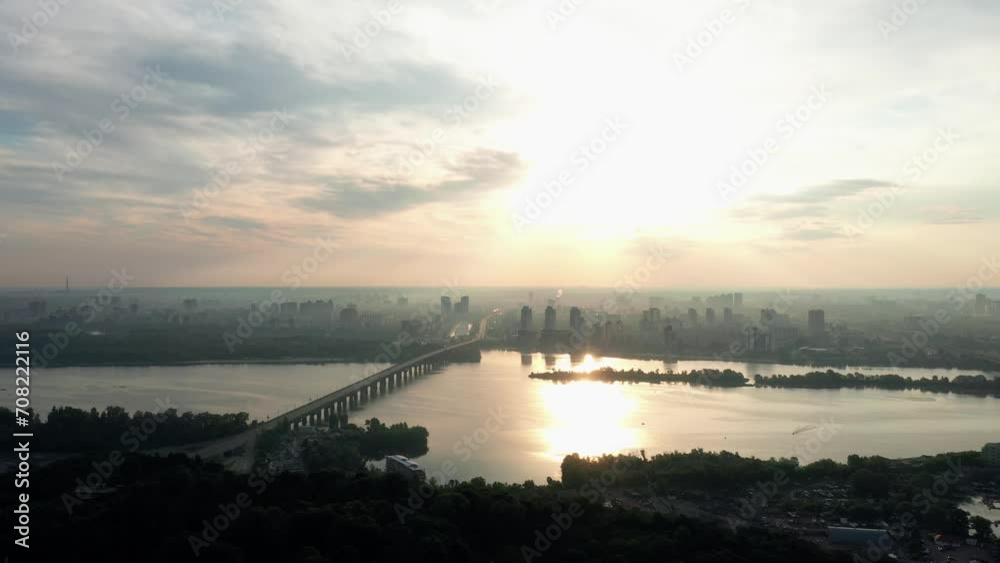 Dnipro river panoramic view at sunset. Beautiful city skyline in the background. Kiev, Ukraine. Dnipro river panoramic view at sunset. Beautiful city skyline in the background. Kiev, Ukraine.