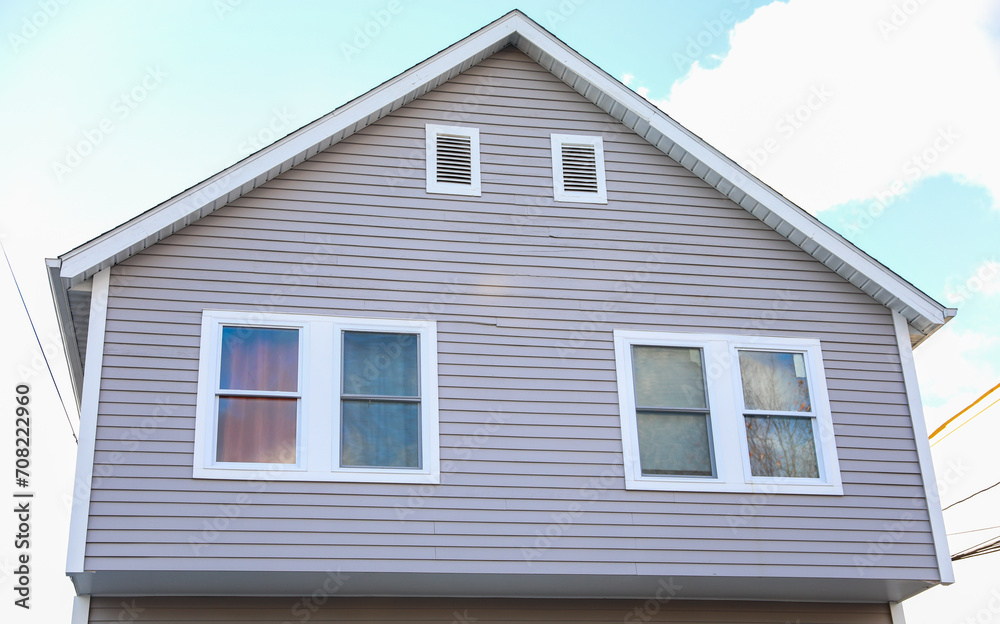suburban house bathed in warm sunlight symbolizing the American dream of home ownership, facing challenges of mortgage rates and inflation suburban house bathed in warm sunlight symbolizing the American dream of home ownership, facing challenges of mortgage rates and inflation