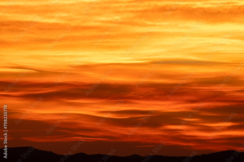 Bands of Red Orange and Yellow Span Across Sky