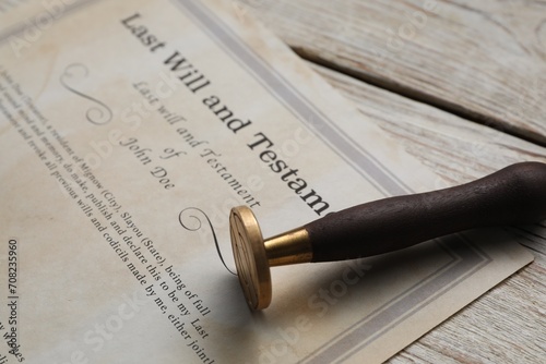Last Will and Testament with wax stamp on wooden table, closeup