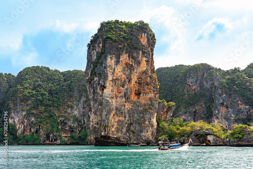 The Ao Nang tower, a solitary sea stack between Ao Nang beach and Rai Leh in the Krabi province This crag is only accessible by water so a long-tail boat ride, kayak or paddleboard is required photo