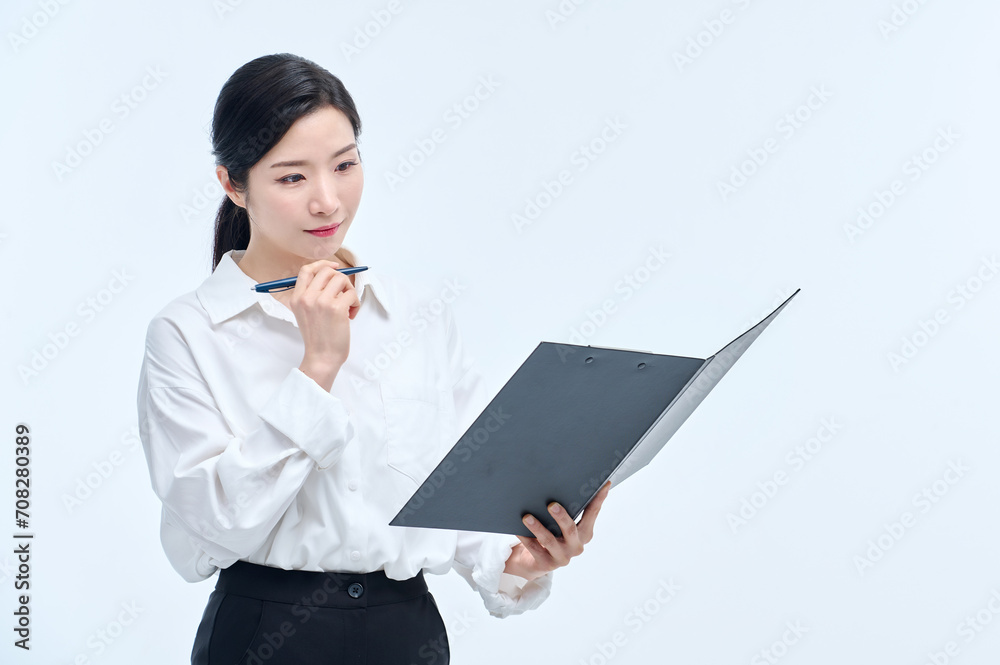 A beautiful Asian woman is making various facial expressions and gestures while holding a document file and a ballpoint pen for business. A beautiful Asian woman is making various facial expressions and gestures while holding a document file and a ballpoint pen for business.