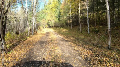 Video of driving along muddy mountain road along Altai river Kumir in Autumn. photo