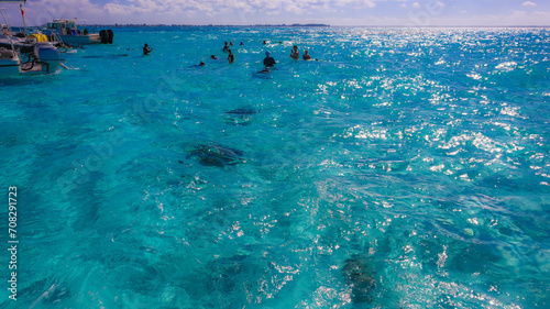 Beautiful view of Stingray city in the Cayman Islands in the Caribbean with turquoise blue green water sea ocean with people 