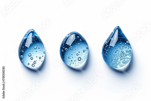 Set of three 3 water round droplets isolated on white background