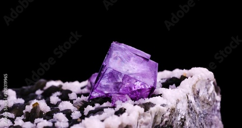 purple fluorite on muscovite with white dolomite and orange sheelite (from Yaogangxian mine, Chenzhou, Hunan, China) 360° full rotation on black background. Yaogangxian, hunan, china. photo