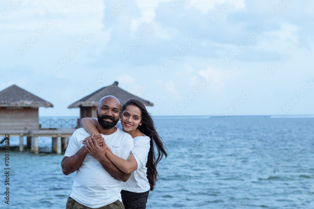 A picture of a guy and a girl taken from Maldives