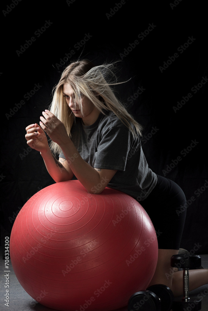 Portrait of a young beautiful girl working out in the gym. Portrait of a young beautiful girl working out in the gym.