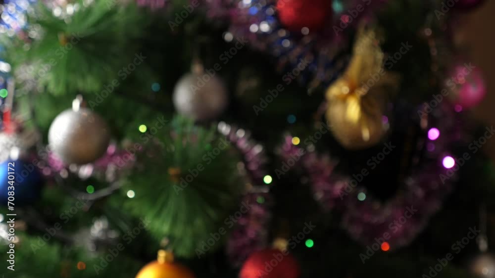 In the background, Christmas trees with twinkling garlands offer toasts with glasses of champagne In the background, Christmas trees with twinkling garlands offer toasts with glasses of champagne