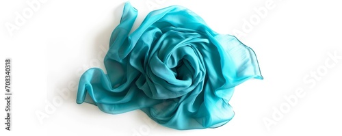 Bright blue turquoise colour silk draped scarf, isolated over white background. AI generated image. 