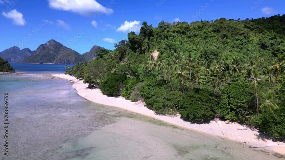 Waves gently lap on the sand at Maremegmeg Beach near El Nido town on Palawan Island in the Philippines Waves gently lap on the sand at Maremegmeg Beach near El Nido town on Palawan Island in the Philippines