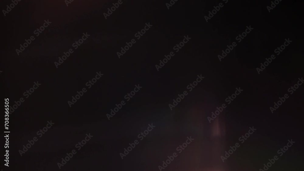 Optical flares with rainbow reflection on black background with dissolve animation 4k footage, optical flares, lens flares animation