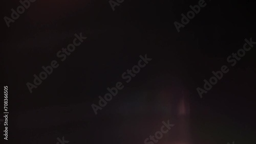 Optical flares with rainbow reflection on black background with dissolve animation 4k footage, optical flares, lens flares animation