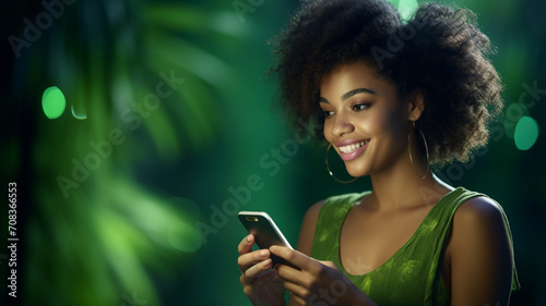 Beautiful black woman holding her cell phone
