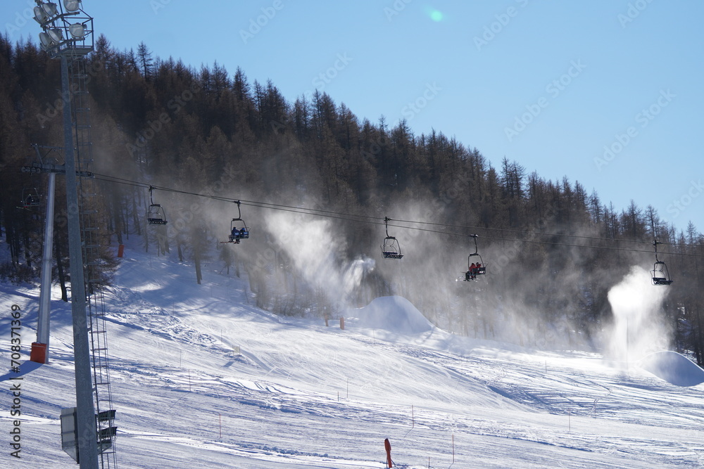 a line of funiculars in winter in mountains a line of funiculars in winter in mountains