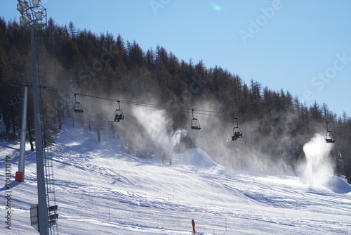 a line of funiculars in winter in mountains