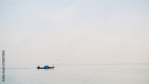 Indian boat on a river, blue hood boat.