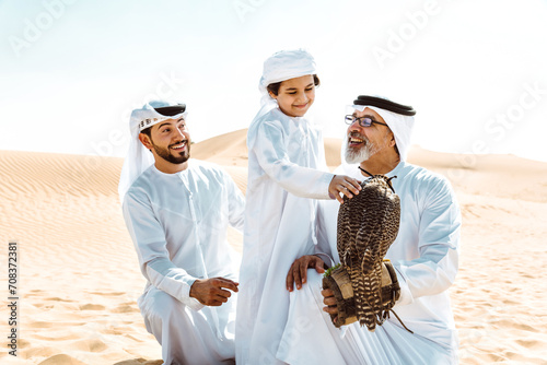Three generation family making a safari in the desert of Dubai photo