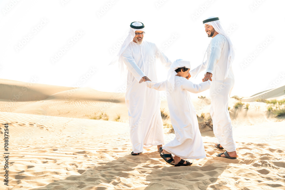 Naklejka premium Three generation family making a safari in the desert of Dubai