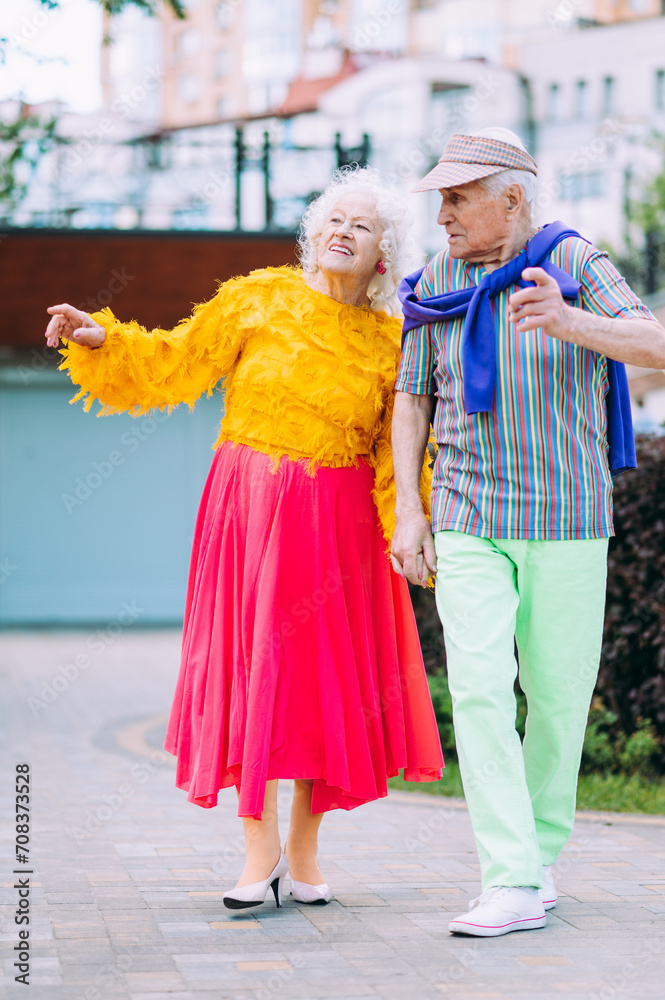 old modern couple dressing fashionable colored clothes