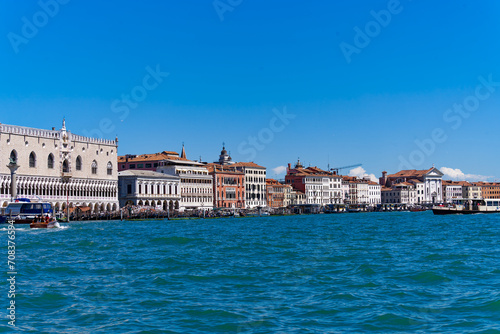 Old town of Italian City of Venice with colorful facades of historic houses and church tower seen from Canale san Giorgio on a sunny summer day. Photo taken August 7th  2023  Venice  Italy.