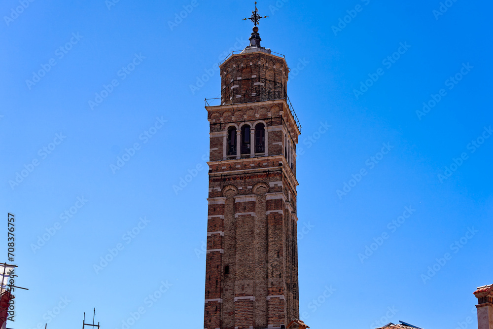 Old town of Italian City of Venice with church tower of Basilica di Santa Maria Gloriosa dei Frari on a sunny summer day. Photo taken August 7th, 2023, Venice, Italy.