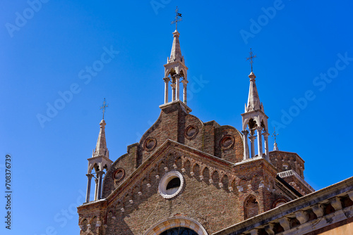 Old town of Italian City of Venice with roof of church named Santa Maria Gloriosa dei Frari on a sunny summer day. Photo taken August 7th, 2023, Venice, Italy. photo