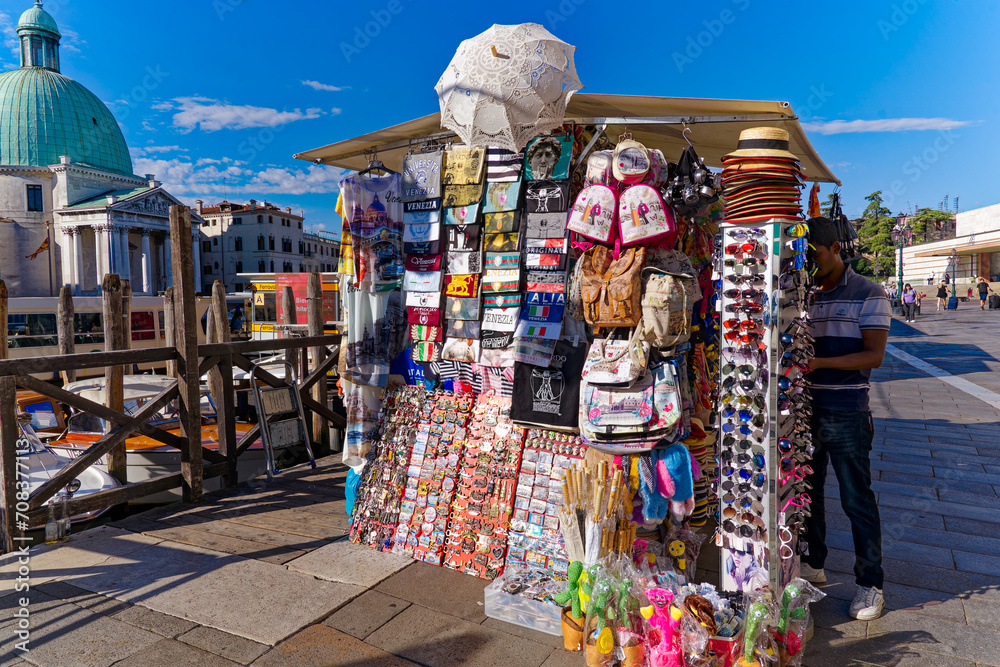 Old town of Italian City of Venice with souvenir stall at Fondamenta Santa Lucia on a sunny summer day. Photo taken August 6th, 2023, Venice, Italy. Old town of Italian City of Venice with souvenir stall at Fondamenta Santa Lucia on a sunny summer day. Photo taken August 6th, 2023, Venice, Italy.