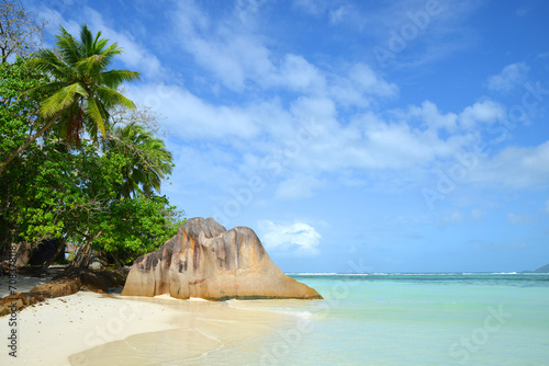 Anse Source d'Argent beach with big granite rocks in sunny day. La Digue Island, Seychelles.