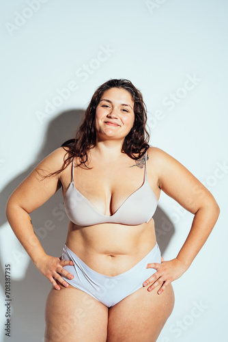 Plus size woman posing in studio in lingerie © oneinchpunch