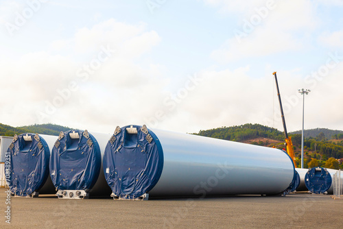 New packaged wind turbine blades lie on the territory of the seaport. photo