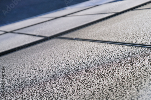 Frost pattern on photovoltaic modules on a cold sunny day in winter
